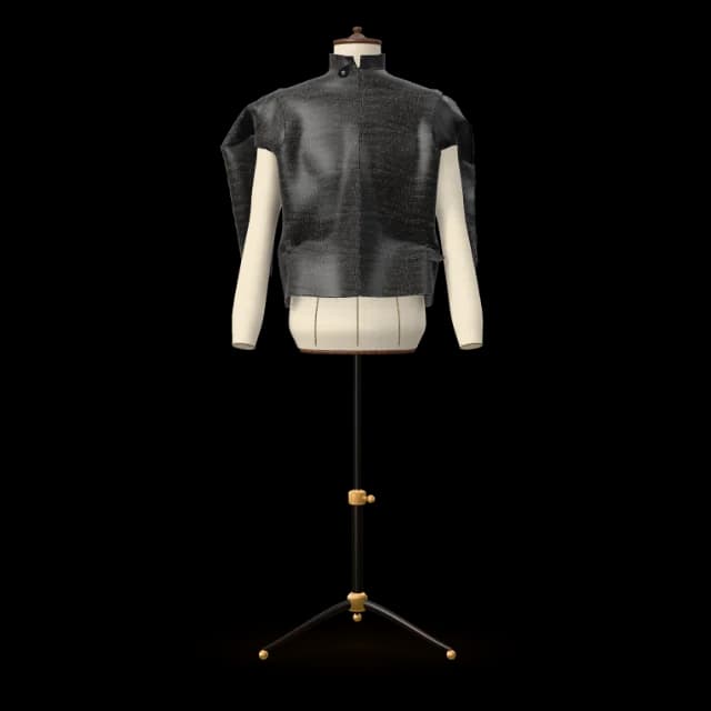 Black crocodile-textured café racer leather jacket with a band collar on a dress form